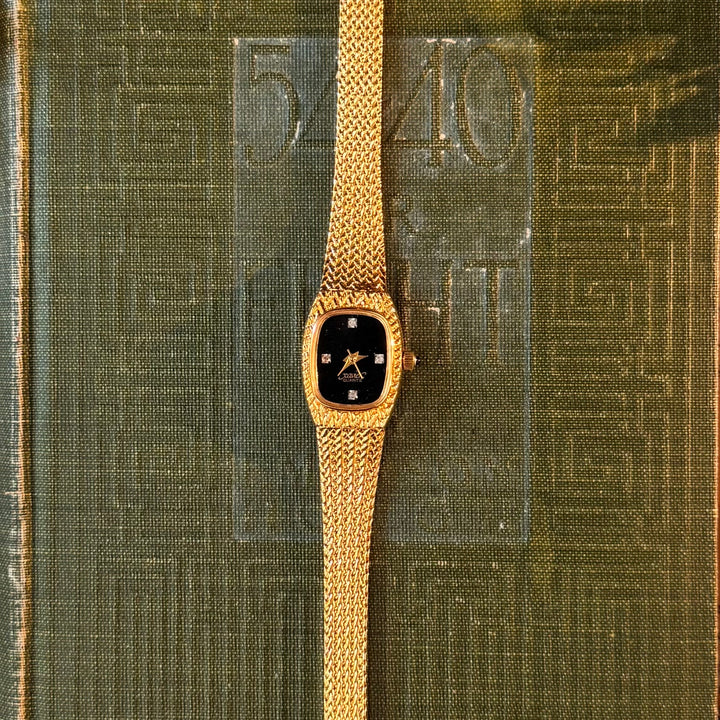 Gold Watch with Black Face