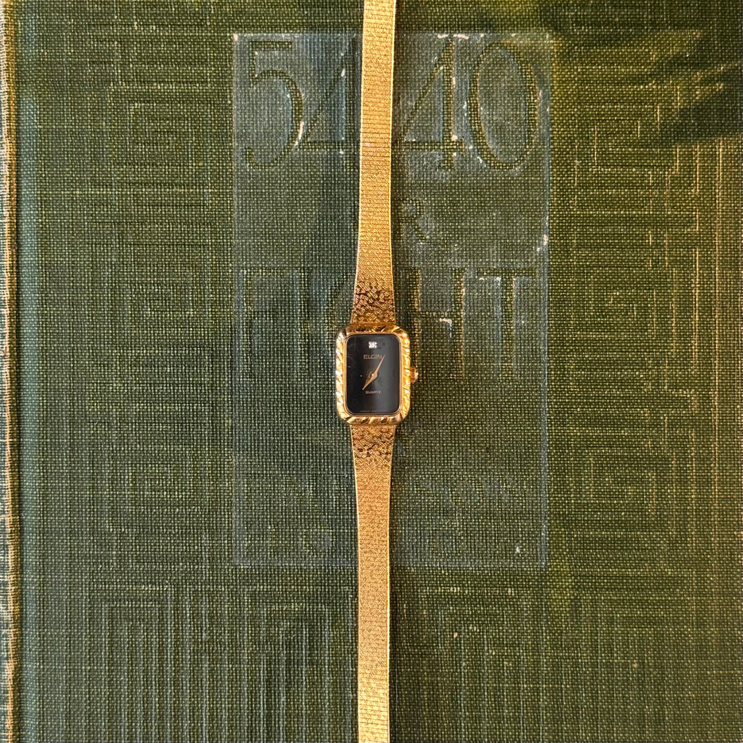 Gold Watch with Black Face