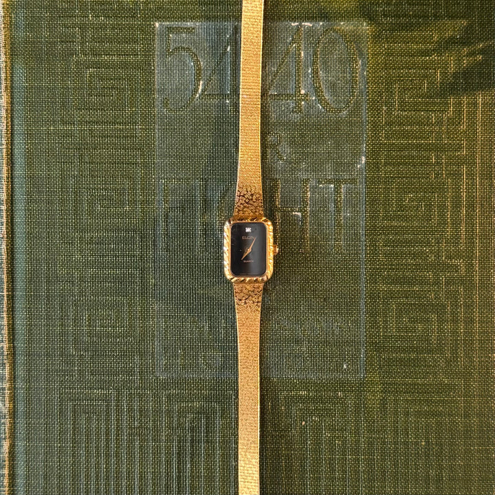 Gold Watch with Black Face