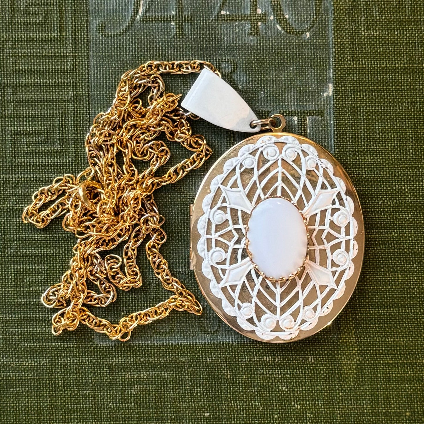 Gold Locket with White Desings