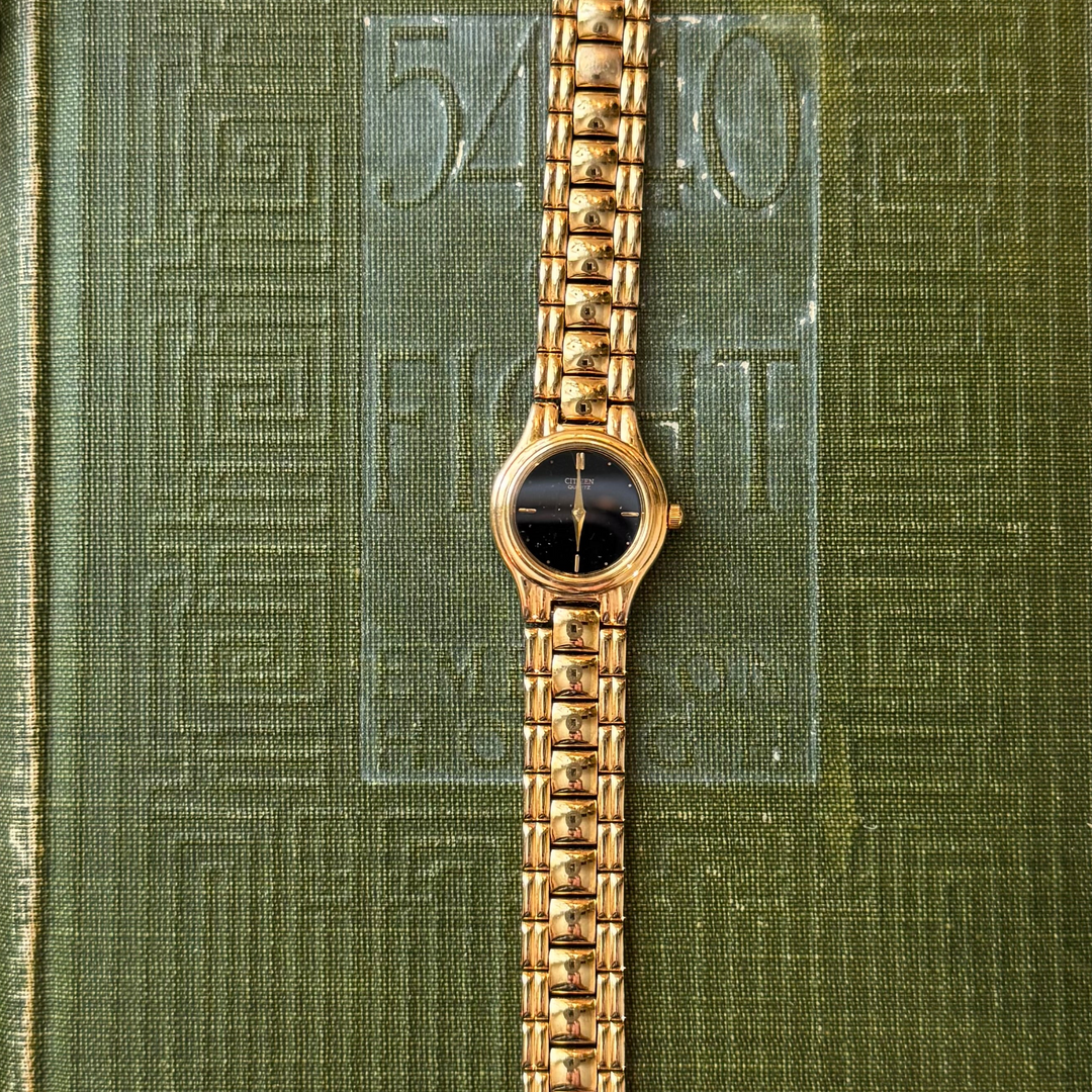 Gold Watch with Black Face
