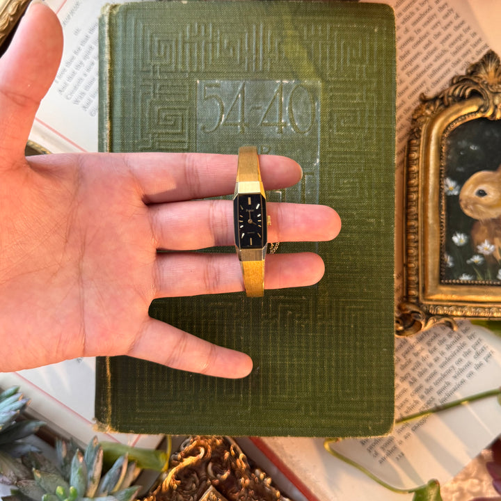 Gold Watch with Black Face