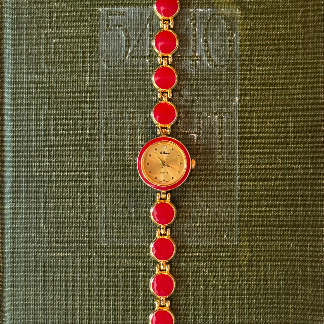 Gold Watch with Red Accents