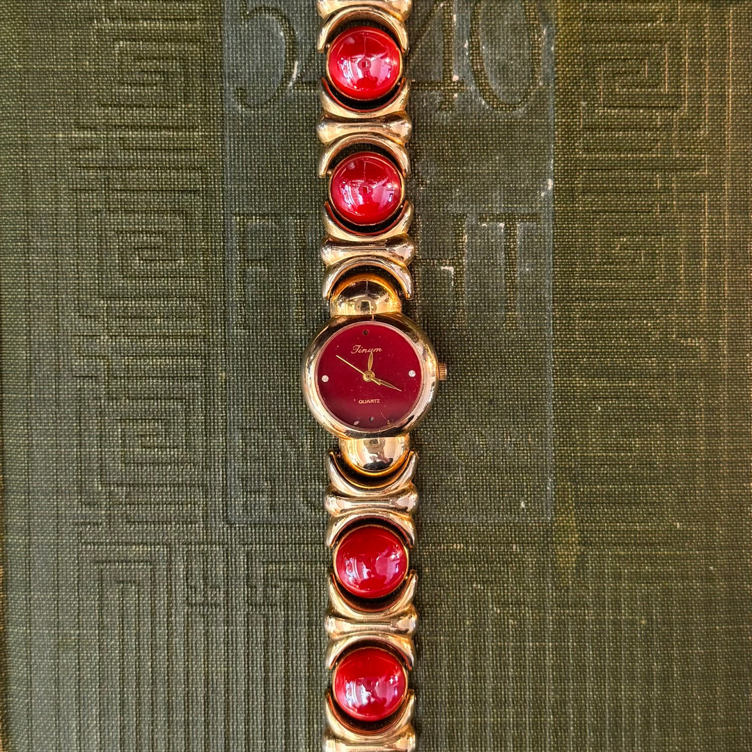 Gold Watch with Red Accents