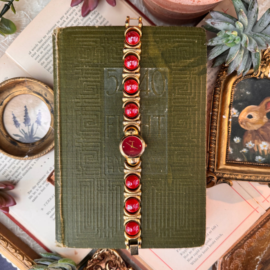 Gold Watch with Red Accents