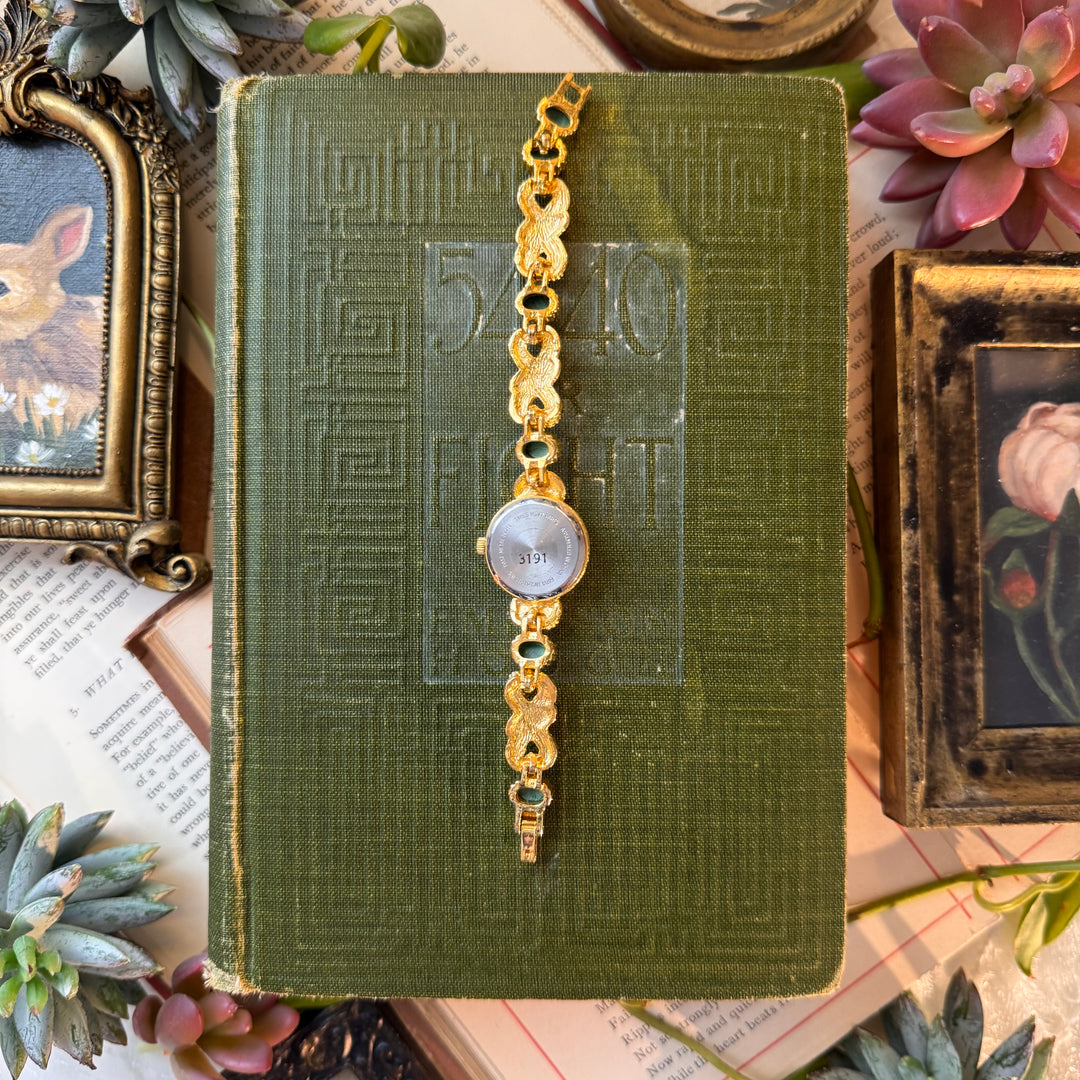 Gold Watch with Red and Green Stones