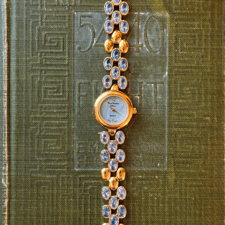 Gold Marcel Drucker Watch with Blue Gemstones