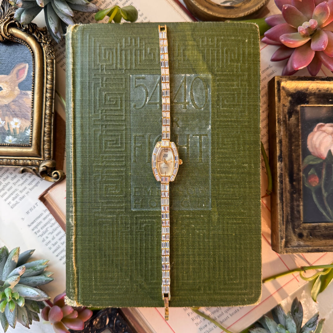 Gold Nolan Miller Watch with Baguette Stones