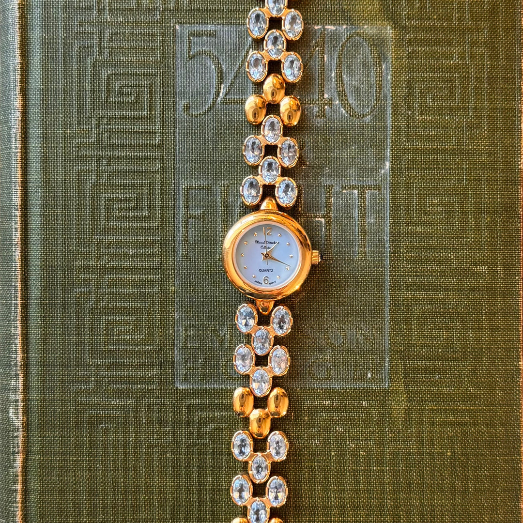 Gold Marcel Drucker Watch with Blue Gemstones