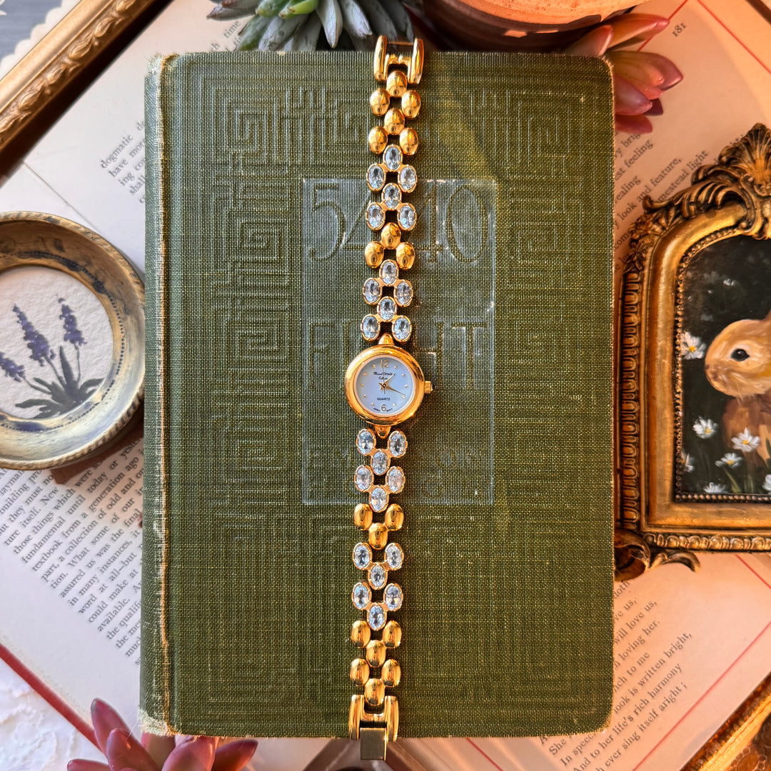 Gold Marcel Drucker Watch with Blue Gemstones