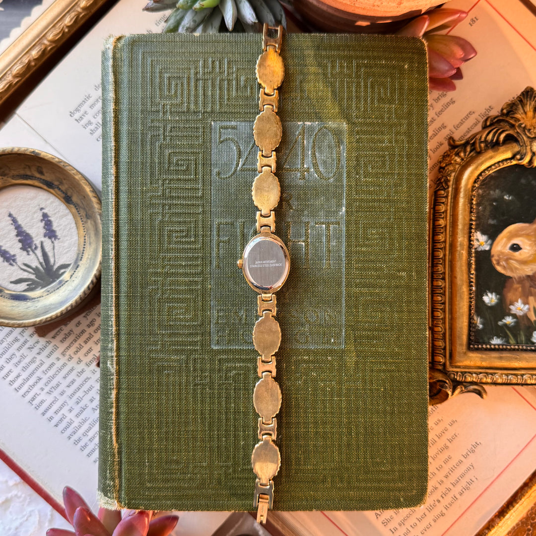 Gold Watch with Purple Cabochon Stones