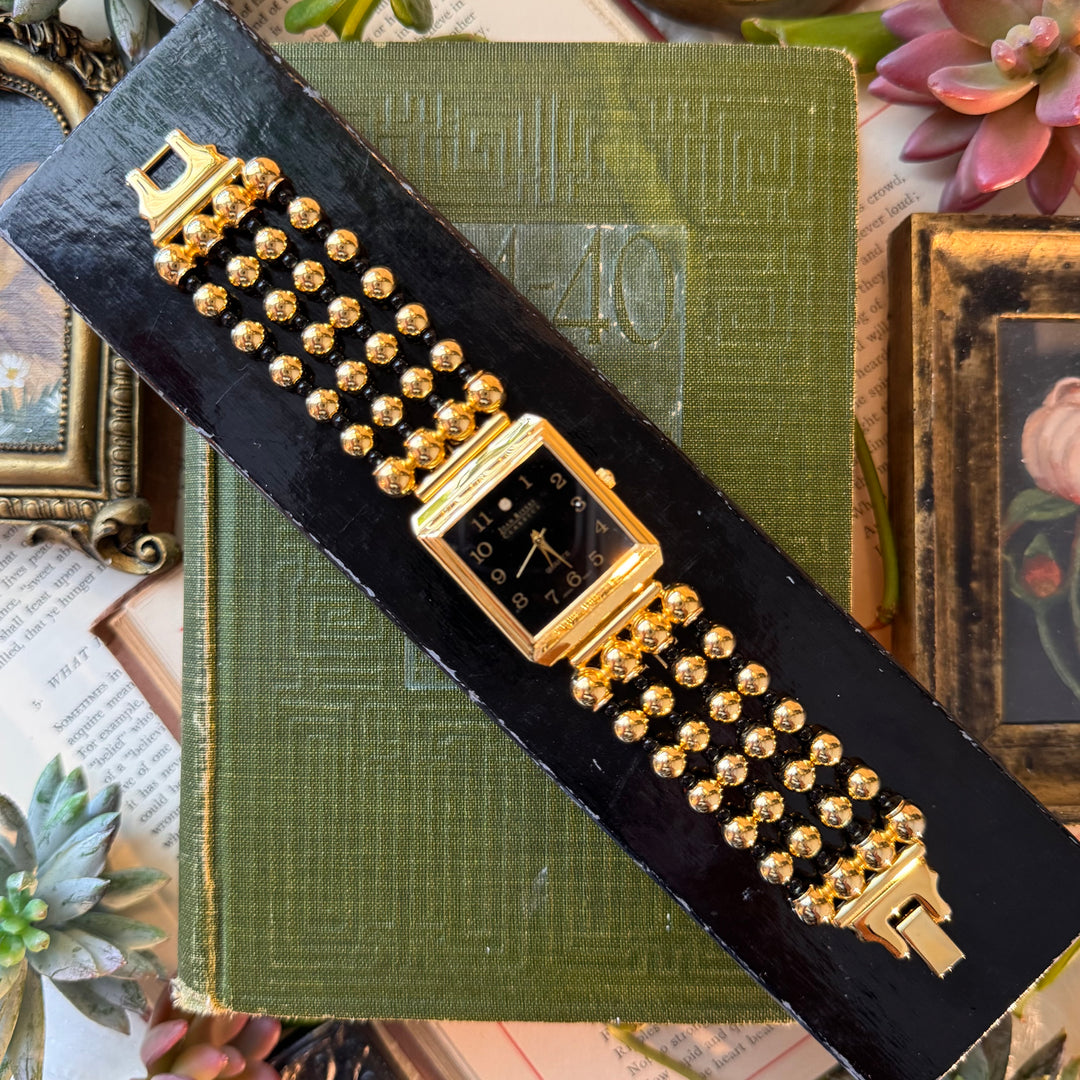 Gold Watch with Black Face and Accents