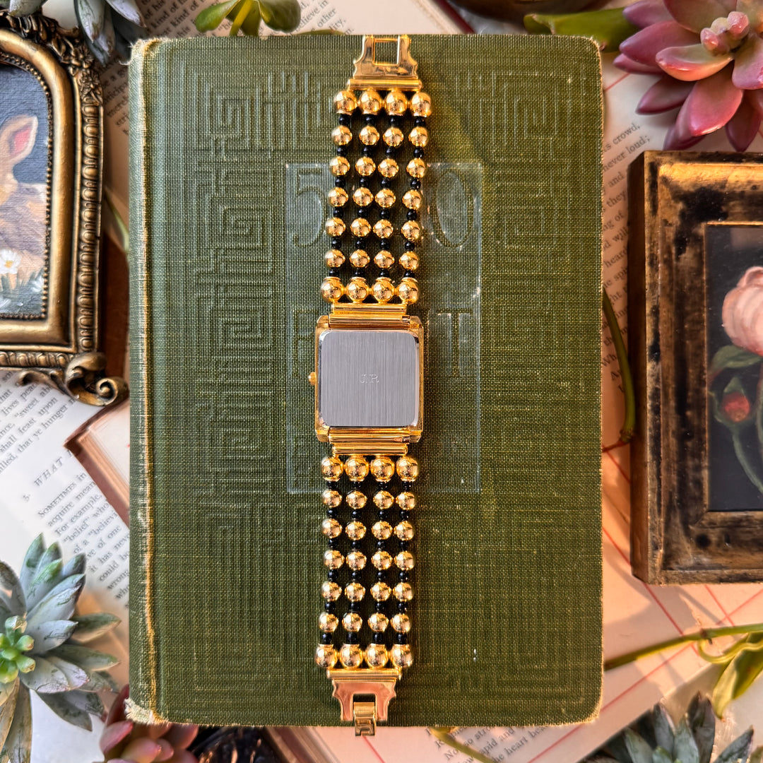 Gold Watch with Black Face and Accents