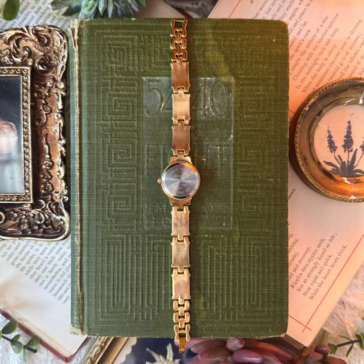 Gold Watch with Green Accents