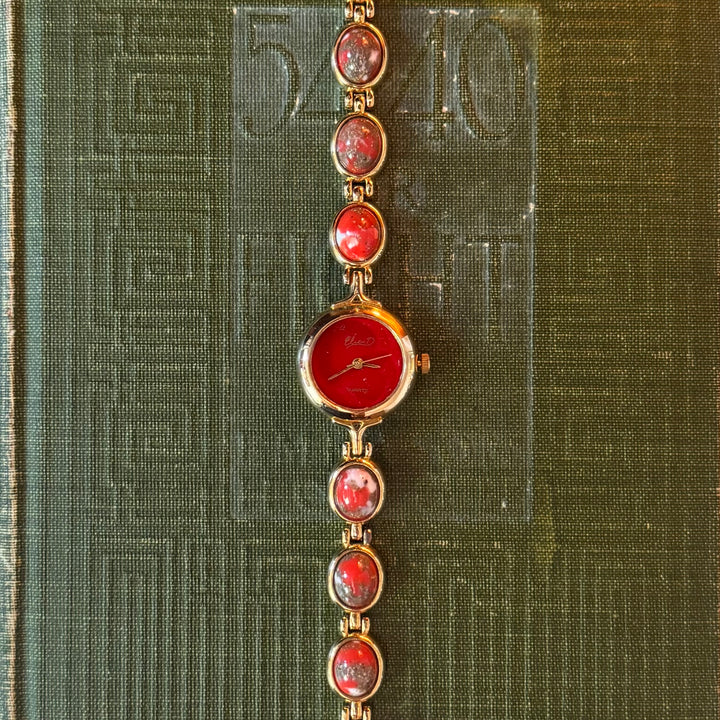 Gold Watch with Red Accents