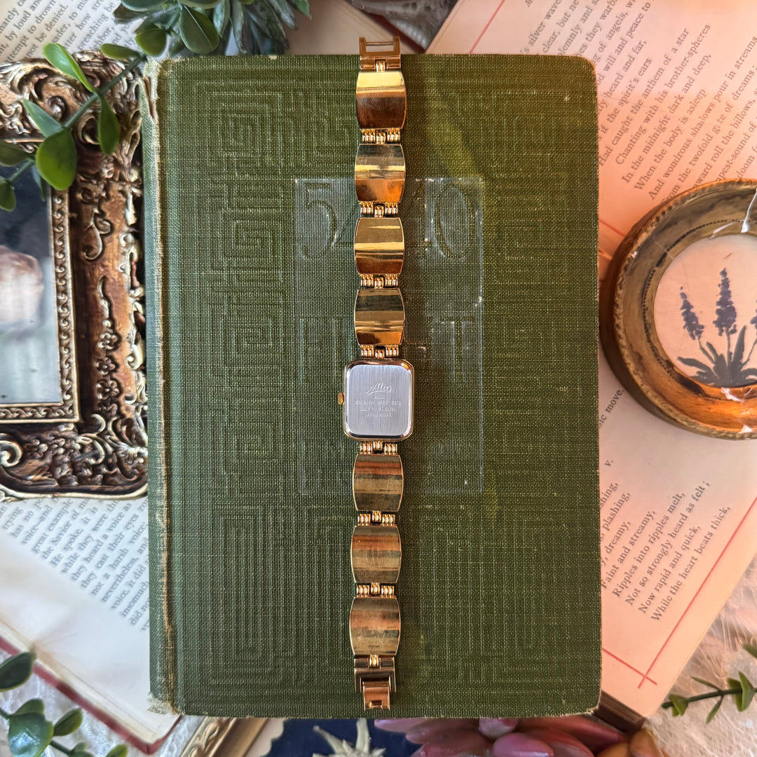 Gold Watch with Black and White Band