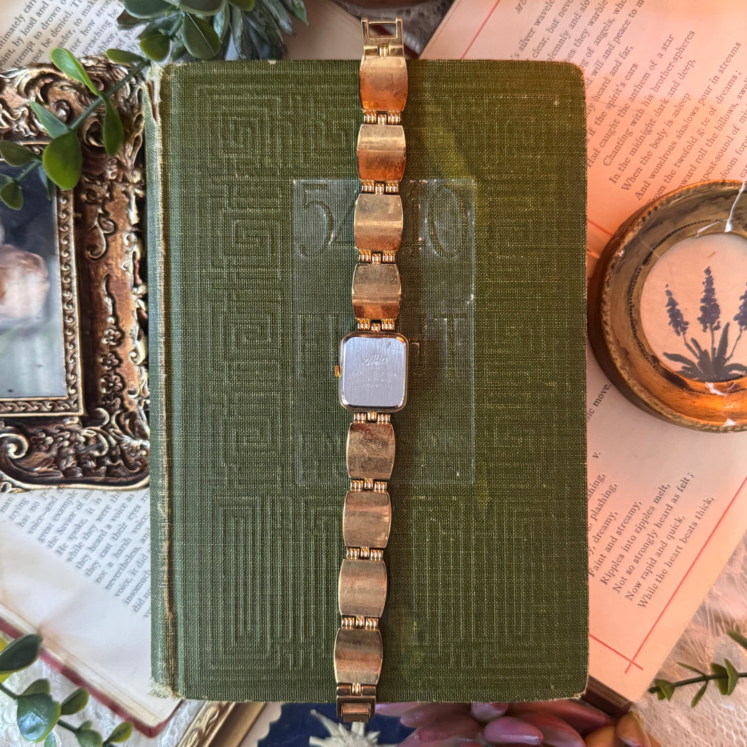 Gold Watch with Black & White Band