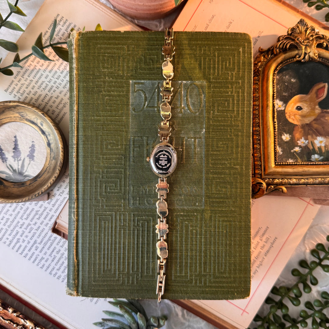 Gold Watch with Red Rhinestones