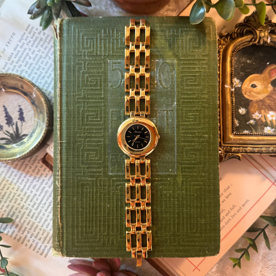 Gold Watch with Black Face