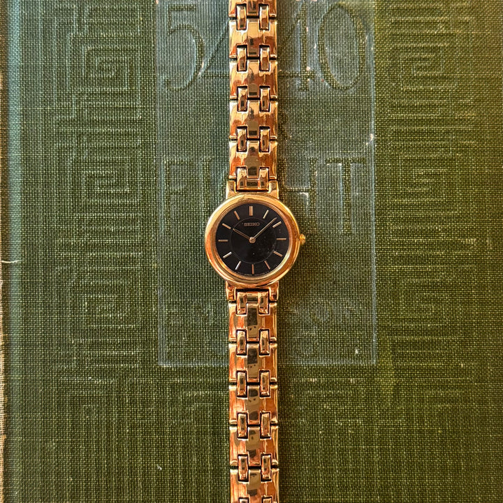 Gold Seiko Watch with Black Face