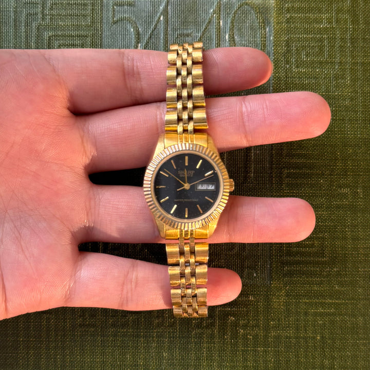 Gold Watch with Black Face